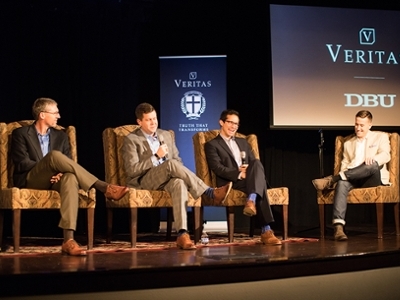 A panel discusses culture on the stage of the Vertias event